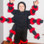 DIY Spider Costume for Kids - Make this easy, fun, and creepy DIY Spider Costume for Kids for a creepy crawly frugal do it yourself Halloween costume! So cool. Made from just a few black shirts!
